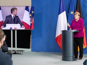 caption: German Chancellor Angela Merkel and French President Emmanuel Macron hold a joint video news conference on Monday to propose a European Union coronavirus recovery fund of 500 billion euros.