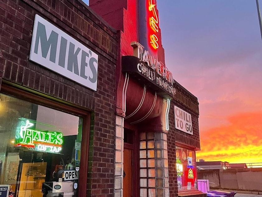 caption: The sun sets at Mike's Chili Parlor, located in the same building its been in since 1939.