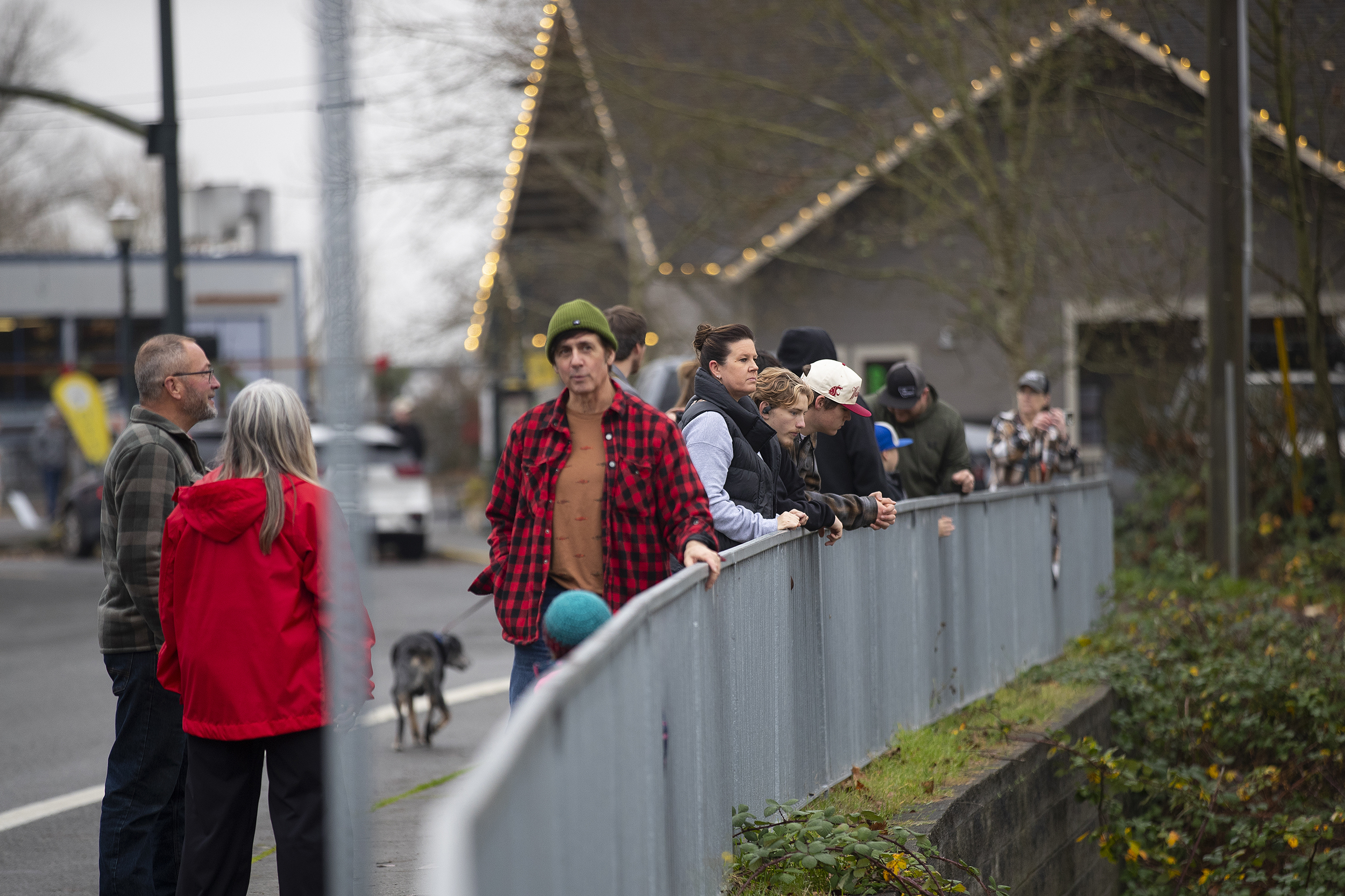 caption: Crowds gather to watch the raging Snohomish River on Friday, December 12, 2025, in downtown Snohomish. 