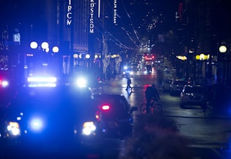 caption: Patrol cars and ambulances are shown at the intersection of Third Avenue and Pine Street on Wednesday, Jan. 22, 2020.