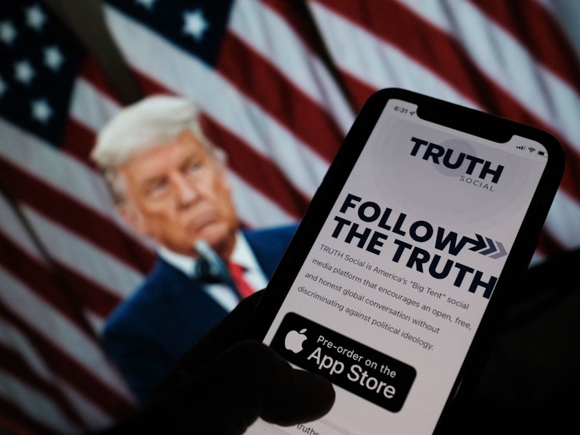 caption: Former President Donald Trump on Wednesday announced plans  to launch his own social networking platform called TRUTH Social, which is expected to begin its beta launch for "invited guests" next month.