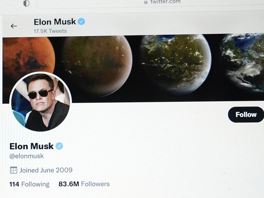caption: Part of the Twitter page of Elon Musk is seen on the screen of a computer in Sausalito, Calif., in April.