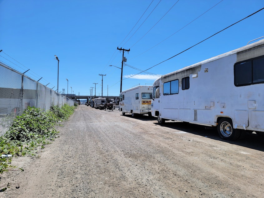 caption: RVs line Colorado Avenue South in Seattle's SoDo Neighborhood on Tuesday, July 18, 2023.