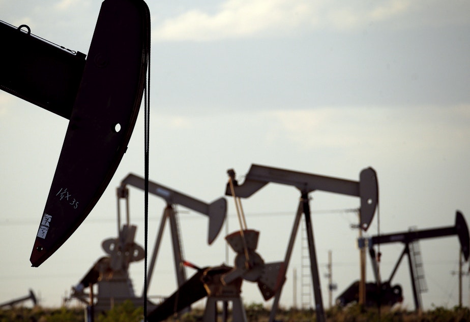 caption: Pump jacks work in a field near Lovington, N.M., in 2015. The Trump administration is lifting an Obama-era rule aimed at limiting emissions of methane, a potent climate-warming gas.