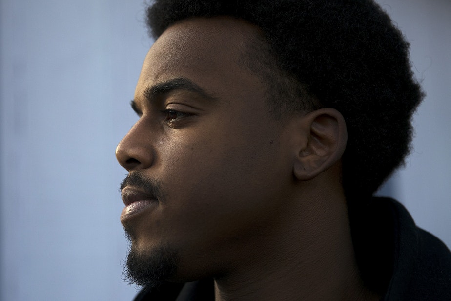 caption: Josiah Hunter was 21 when he witnessed a crash at an ampm minimart in Federal Way. He wound up being arrested after officers asked him to leave the gas station.