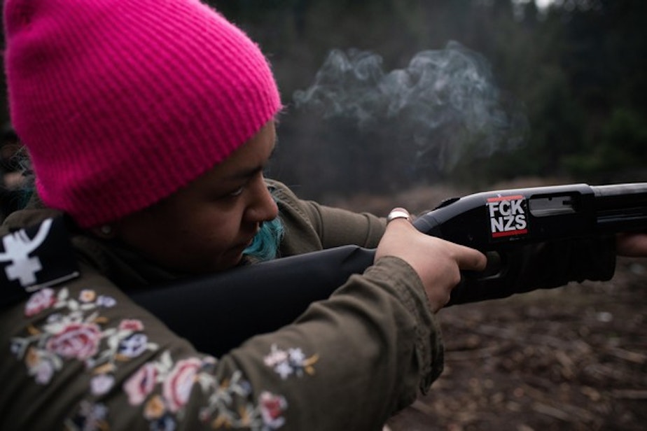 caption: <p>Rosie Strange, a leftist activist who chose to buy a handgun for self defense, fires a friend’s shotgun on February 2, 2019, in Hood River, Oregon.</p>