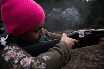 caption: <p>Rosie Strange, a leftist activist who chose to buy a handgun for self defense, fires a friend&rsquo;s shotgun on February 2, 2019, in Hood River, Oregon.</p>