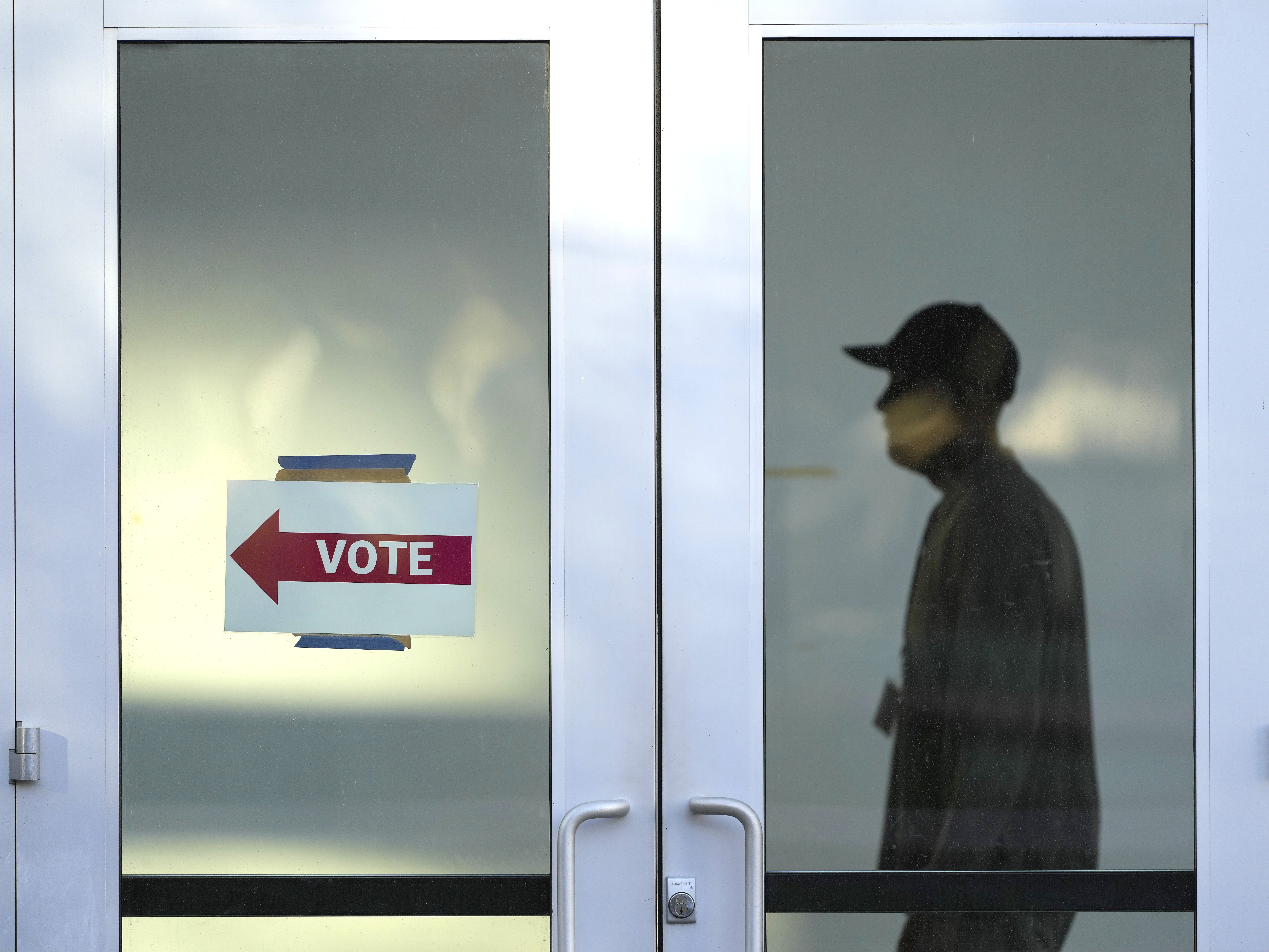 caption: A polling place at the Arizona State University campus, Tuesday, in Phoenix, Ariz. Polling finds that three out of ten voters in Arizona who supported an abortion rights ballot measure also voted for Trump.