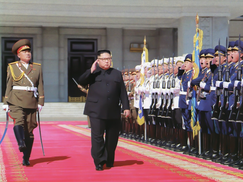 caption: Kim Jong Un inspects troops ahead of North Korea's 70th anniversary parade in Pyongyang in 2018. At least one foreign policy expert warns that U.S. adversaries could take advantage of the uncertainty stemming from President Trump's positive coronavirus test.