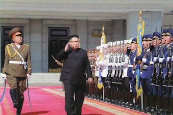 caption: Kim Jong Un inspects troops ahead of North Korea's 70th anniversary parade in Pyongyang in 2018. At least one foreign policy expert warns that U.S. adversaries could take advantage of the uncertainty stemming from President Trump's positive coronavirus test.