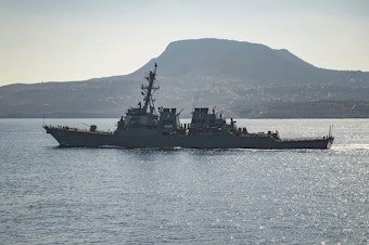 caption: The guided-missile destroyer USS Carney in Souda Bay, Greece. The U.S. military said the ship shot down drones launched from Houthi-controlled areas of Yemen on Saturday.