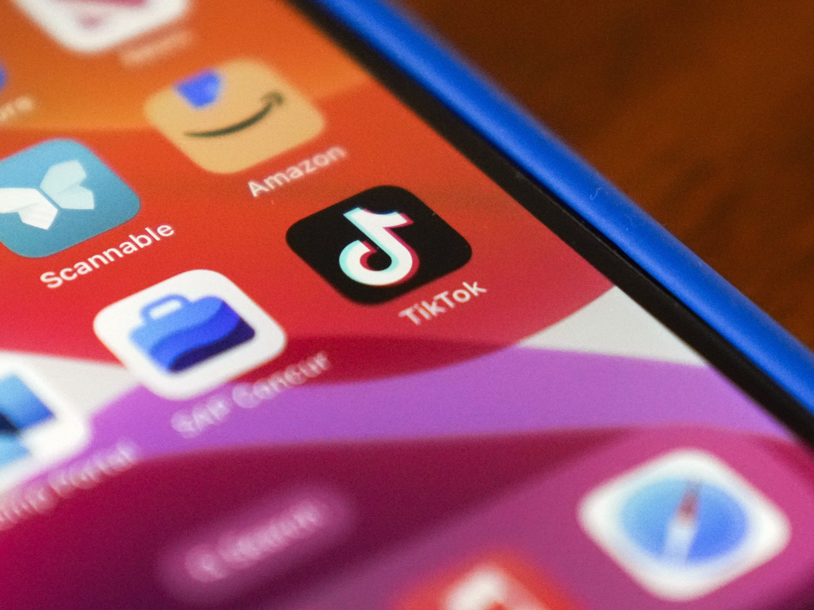 caption: The TikTok app logo is shown on an iPhone on Friday, Jan. 17, 2025, in Houston.