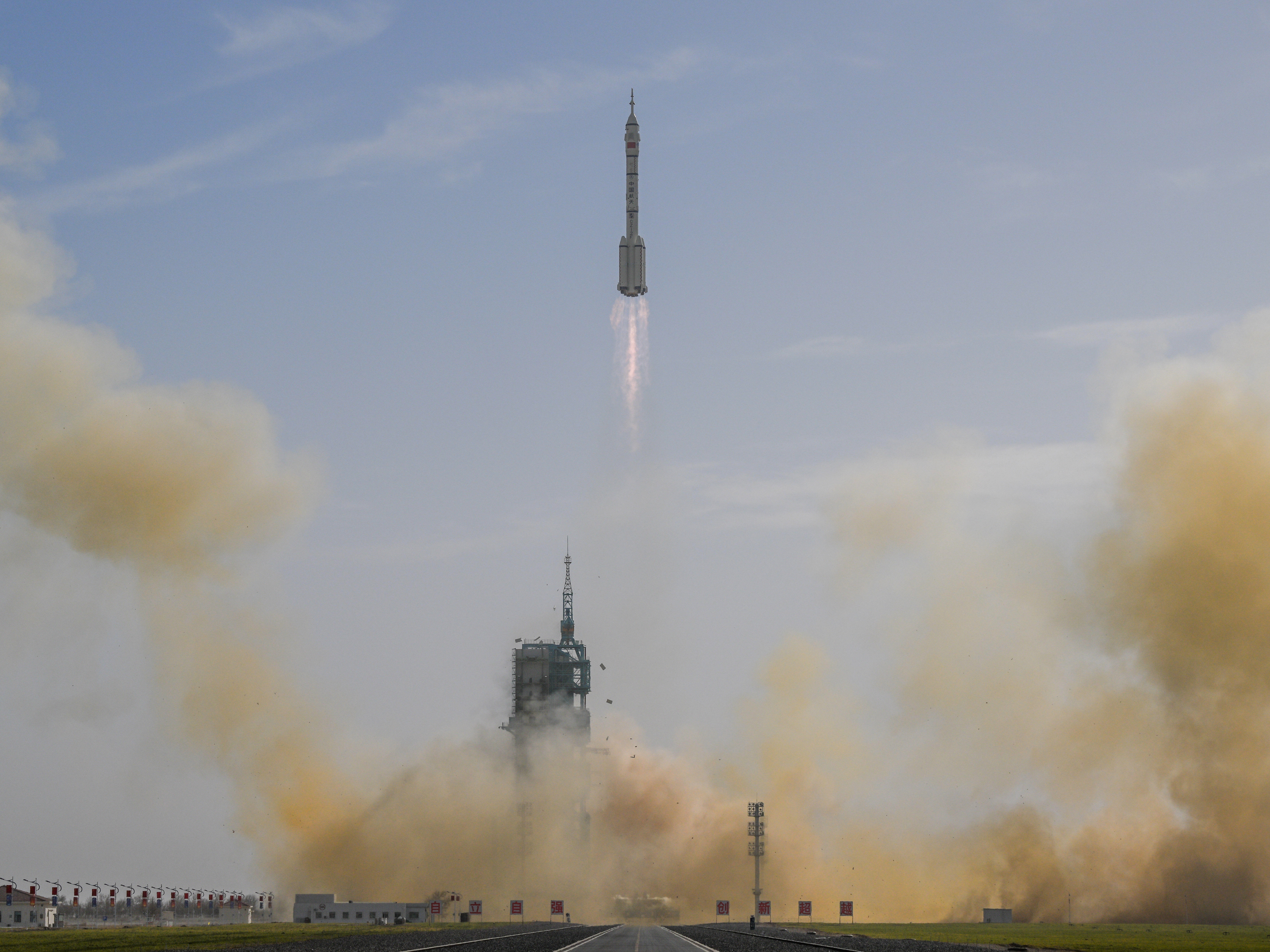 caption: In this photo provided by China's Xinhua News Agency, the Shenzhou-22 spaceship, atop a Long March-2F Y22 rocket, blasts off from the Jiuquan Satellite Launch Center in Jiuquan, northwestern China, on Tuesday.