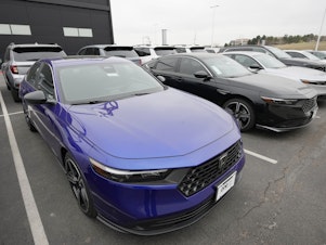 caption: 2024 Accord sedans are displayed at a Honda dealership April 14, 2023, in Highlands Ranch, Colo.
