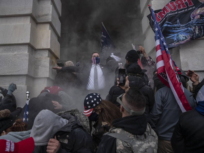 caption: Demonstrators attempt to breach the U.S. Capitol on Wednesday. The insurrection was just the latest chapter in America's ongoing battle over race, writes NPR host Sam Sanders.