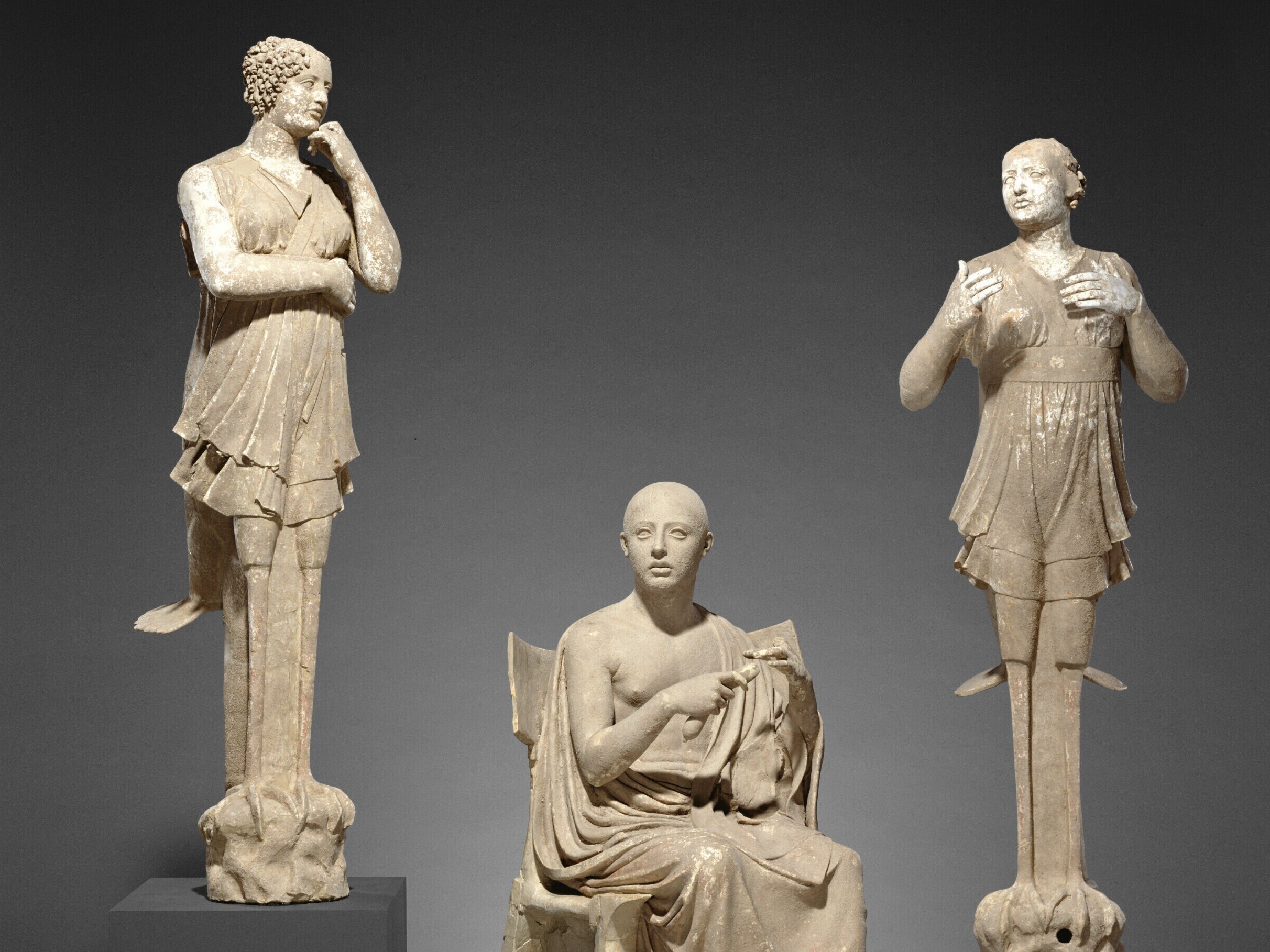 caption: This undated photo provided by The J. Paul Getty Museum shows Sculptural Group of a Seated Poet and Sirens.