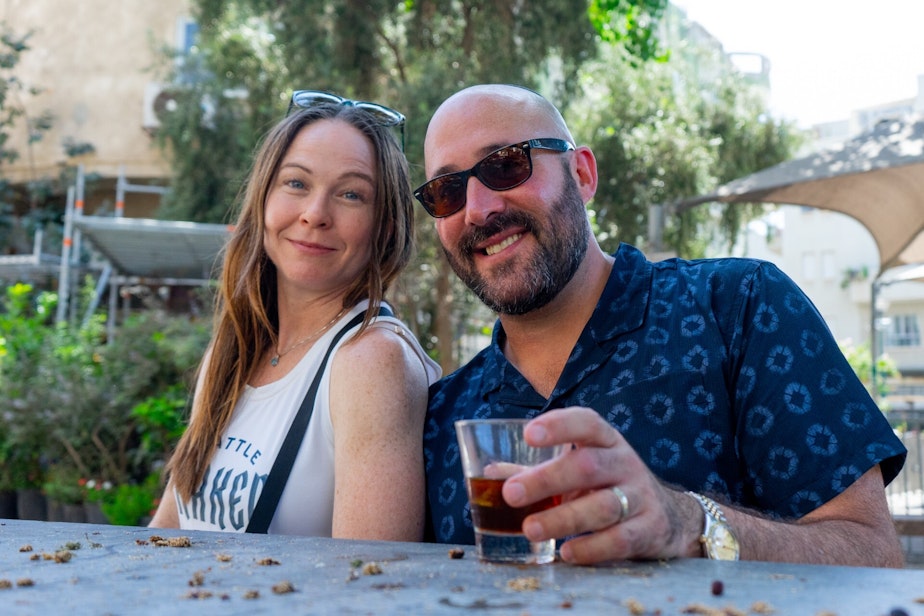 caption: Dan Swedlow an his wife Miriam outside at Tel Aviv coffee shop where their son Shneur worked in 2022.
