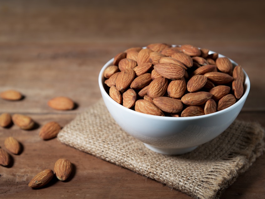 caption: Thanks to a genetic mutation thousands of years ago, modern domesticated sweet almonds are delicious and safe to eat.