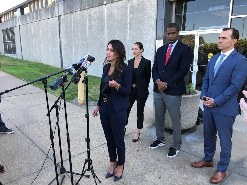 caption: Attorney Alexandra Benevento, center, speaks with reporters during a news conference announcing a cheerleader abuse lawsuit filed in Tennessee on Tuesday, Sept. 27, 2022, in Memphis, Tenn.