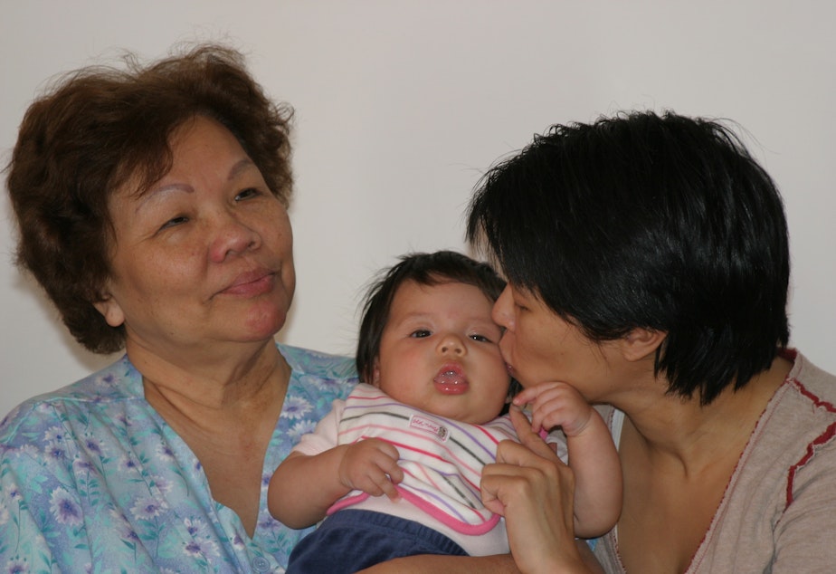 caption: Three generations of a Filipino-American family in Seattle: Erlinda Conde (left) with her granddaughter Charlotte Engrav and daughter Teresa Engrav.