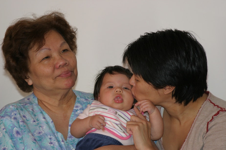caption: Three generations of a Filipino-American family in Seattle: Erlinda Conde (left) with her granddaughter Charlotte Engrav and daughter Teresa Engrav.