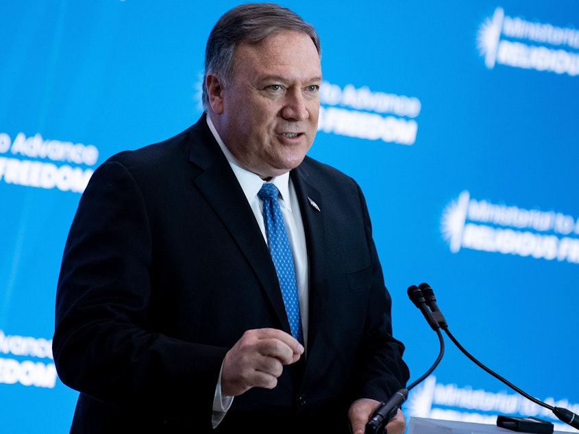caption: Secretary of State Mike Pompeo speaks during a religious freedom summit at the Department of State on Tuesday. Pompeo is headed to Argentina, which is expected to announce it's joining an international coalition to counter Iran.