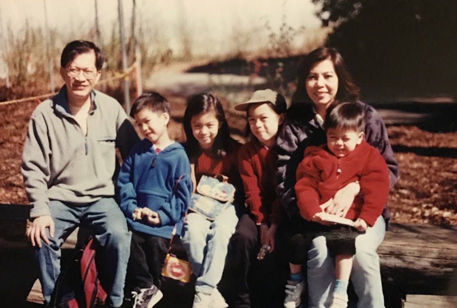 caption: Simon Tran with his family on a camping trip at the Olympic National Park, 1998. From left: Simon's dad Luong, Simon, Christina (eldest sister), Michelle (second eldest sister), Simon's mom My Trang, Francis (brother). 