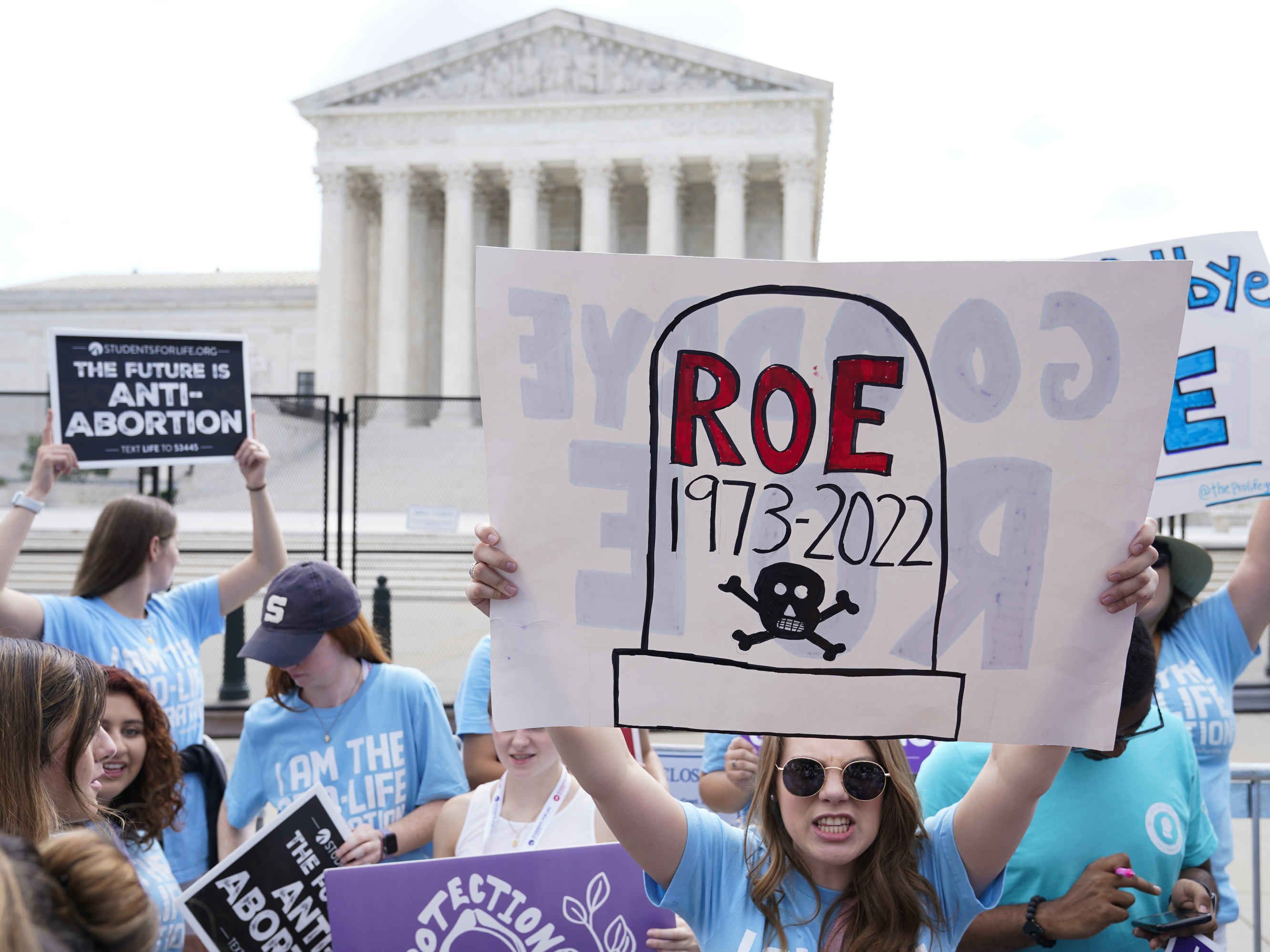 caption: The scene at the U.S. Supreme Court on the day it overturned <em>Roe v. Wade</em> in June 2022. Researchers estimate that 64,565 rape-caused pregnancies have occurred in states that banned abortion since then.