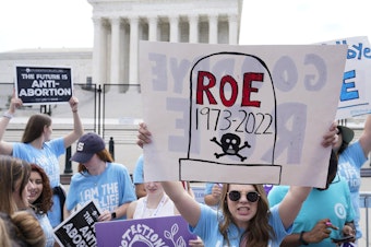 caption: The scene at the U.S. Supreme Court on the day it overturned <em>Roe v. Wade</em> in June 2022. Researchers estimate that 64,565 rape-caused pregnancies have occurred in states that banned abortion since then.