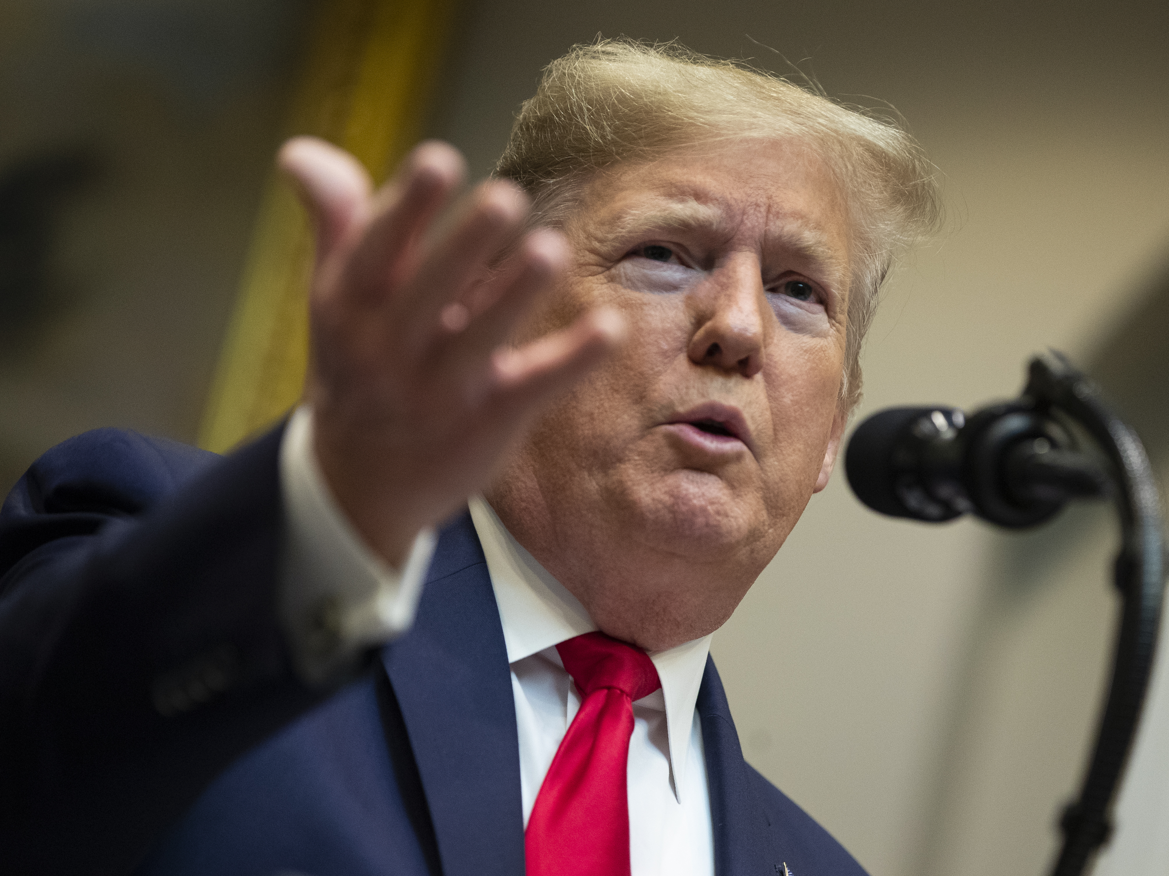 caption: President Trump proposes changes to the National Environmental Policy Act in January. His latest executive order allows agencies to waive requirements of the bedrock law to speed up infrastructure projects.