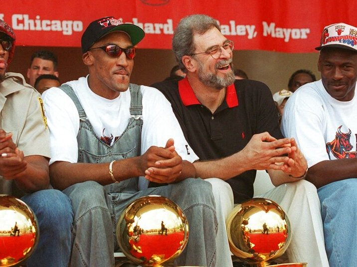 caption: Chicago Bulls Dennis Rodman, Scottie Pippen, coach Phil Jackson and Michael Jordan celebrating their 4th NBA championship in 1996. Chicago's dominance of basketball in the 1990s established the Bulls as a cultural force and worldwide brand.