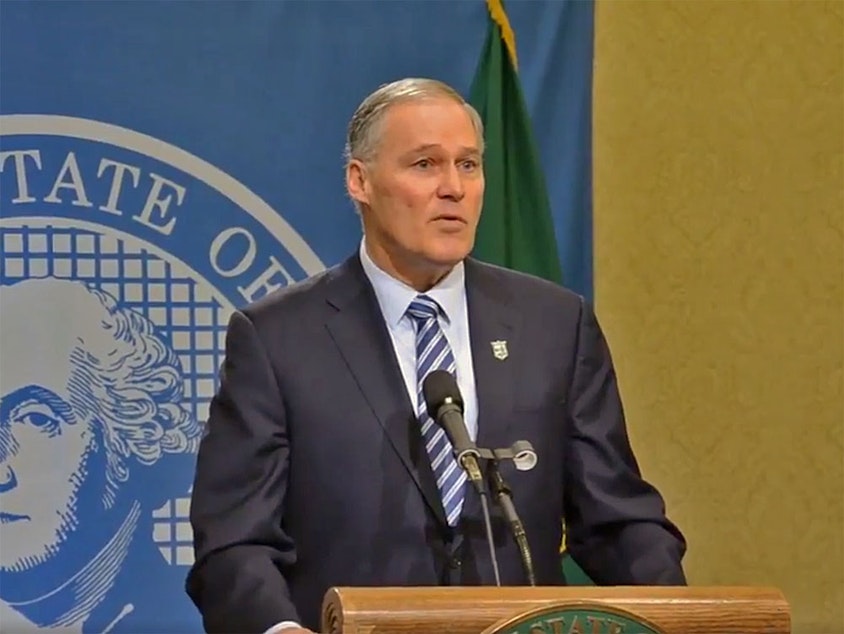 caption: In this file photo, Washington Gov. Jay Inslee speaks at a news conference. On Monday evening, Washington Gov. Jay Inslee issued a "stay-at-home" order in a further attempt to slow the spread of coronavirus.
