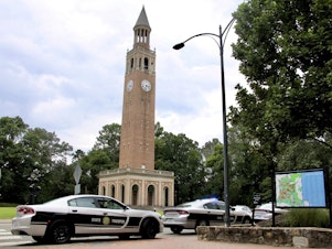 caption: Law enforcement respond to the University of North Carolina at Chapel Hill campus on Monday after the university locked down and warned of an armed person on campus.