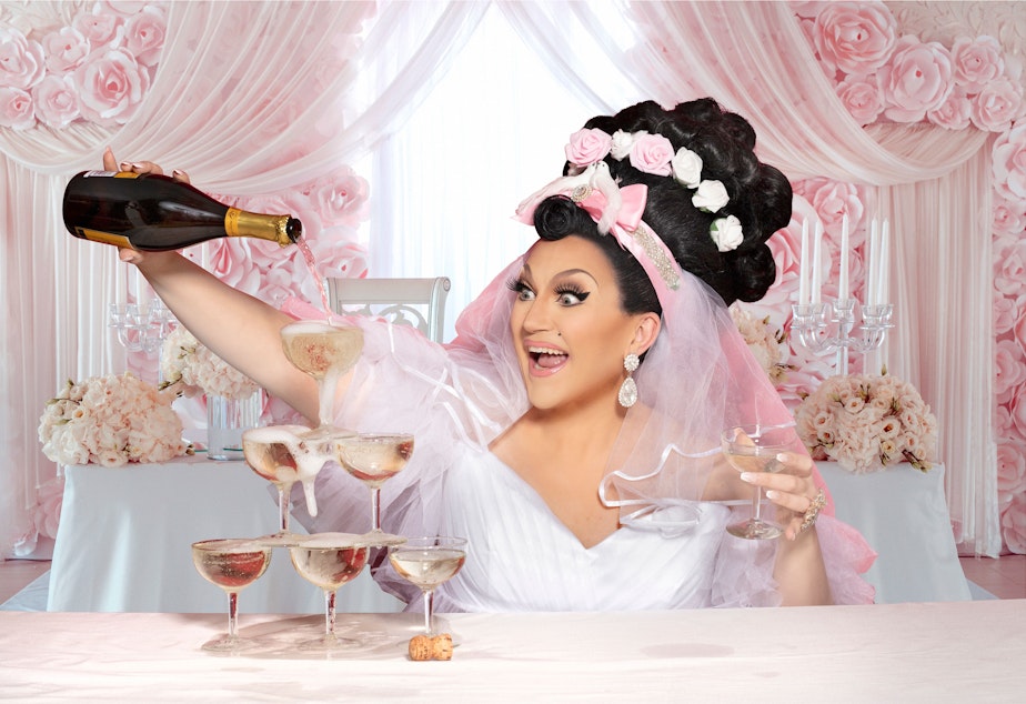 caption: Seattle drag queen BenDeLaCreme pours bubbly in a promotional shot for her one-queen show "READY TO BE COMMITTED."