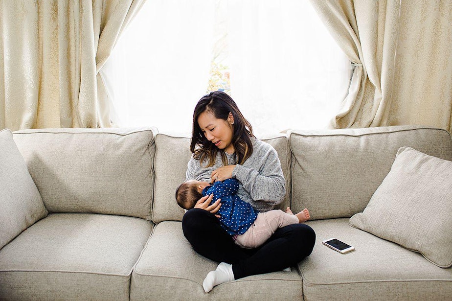caption: Kristen Su of Beacon Hill with her daughter Mia, 6 months.