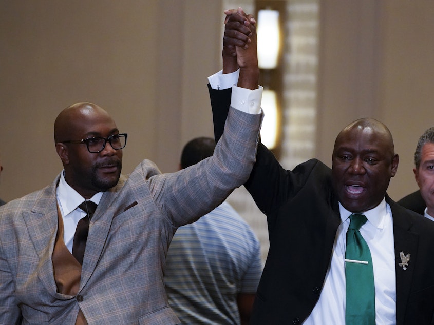 caption: Philonise Floyd (left) and attorney Ben Crump react after a guilty verdict was announced at the trial of former Minneapolis police Officer Derek Chauvin for the murder of Floyd's brother George Floyd