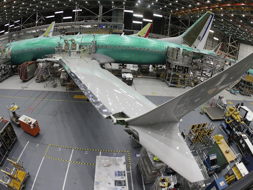 caption: A Boeing 737 MAX 8 airplane sits on the assembly line at Boeing's 737 assembly facility in 2019.