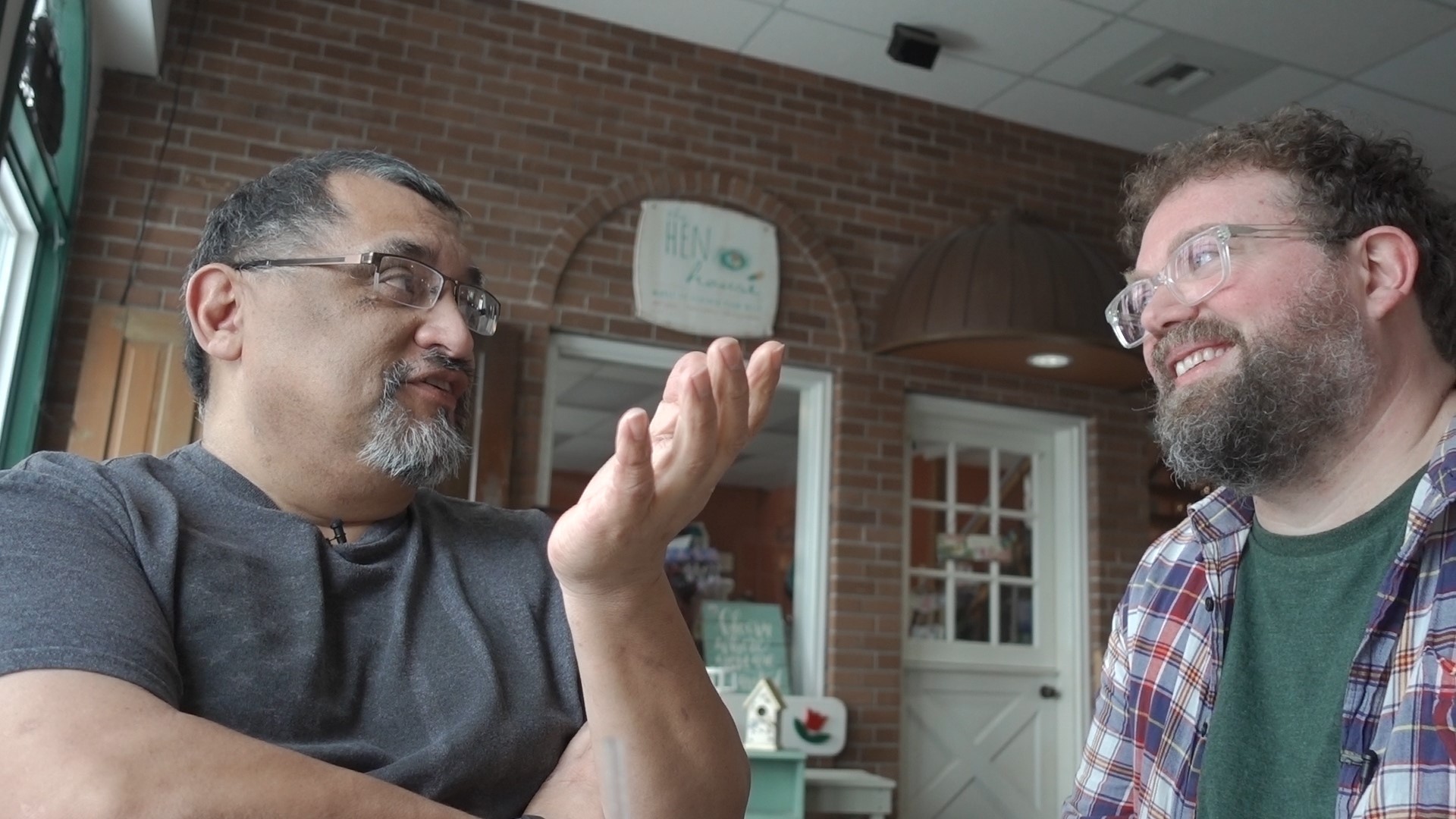 caption: James Allen Smith (right) speaks with a Trump support in Lynden, WA.