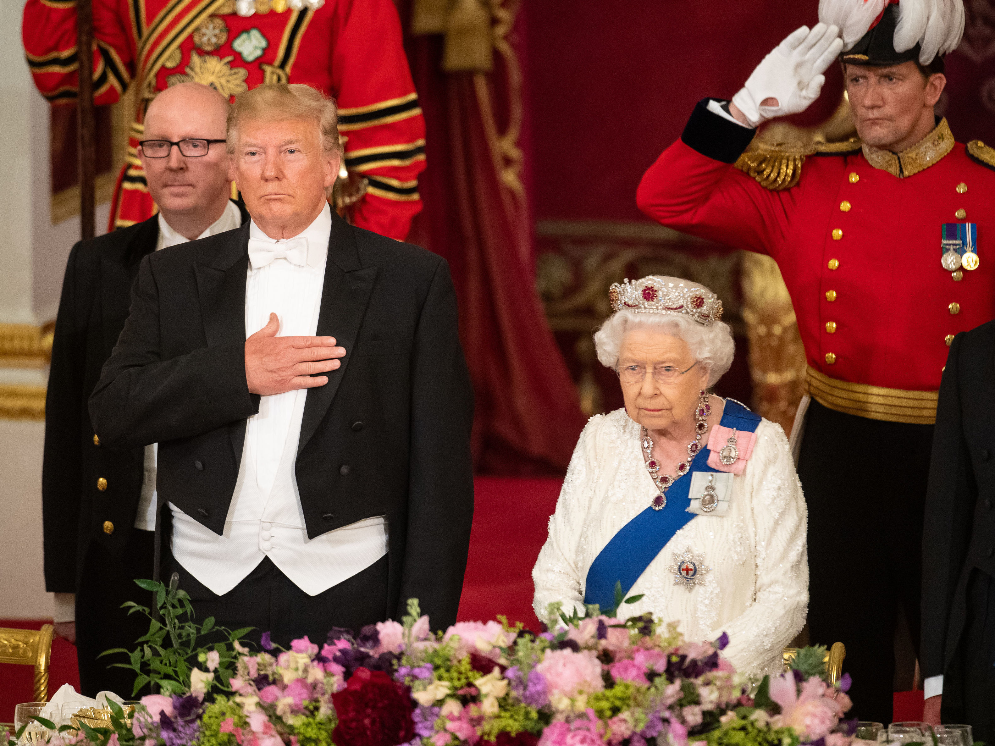 caption: Britain's Queen Elizabeth II hosts President Trump for a State Banquet in the ballroom at Buckingham Palace in London on Monday, on the first day of the U.S. president and the first lady's three-day state Visit to the U.K.