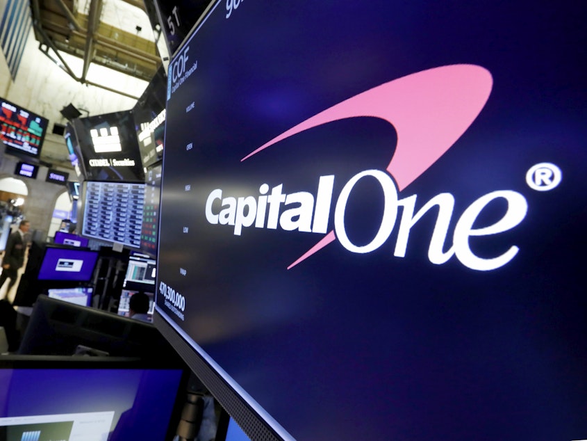 caption: The logo for Capital One Financial is displayed above a trading post on the floor of the New York Stock Exchange, July 30, 2019. Capital One Financial is buying Discover Financial Services for $35 billion, in a deal that would bring together two of the nation's biggest lenders and credit card issuers, according to a news release issued by the companies Monday, Feb. 19, 2024.