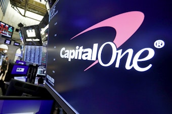 caption: The logo for Capital One Financial is displayed above a trading post on the floor of the New York Stock Exchange, July 30, 2019. Capital One Financial is buying Discover Financial Services for $35 billion, in a deal that would bring together two of the nation's biggest lenders and credit card issuers, according to a news release issued by the companies Monday, Feb. 19, 2024.