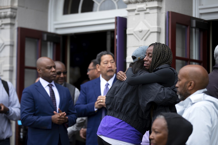 caption: Parents, community members and officials gathered to welcome students back to Garfield high school for the first time following the fatal shooting of their 17-year-old classmate, Amarr Murphy, on Tuesday, June 11, 2024, at Garfield High School in Seattle. 