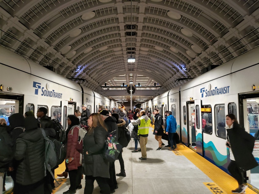 caption: Seattle commuters transfer trains on the first workday of the new year on Monday, January 6th, 2020.