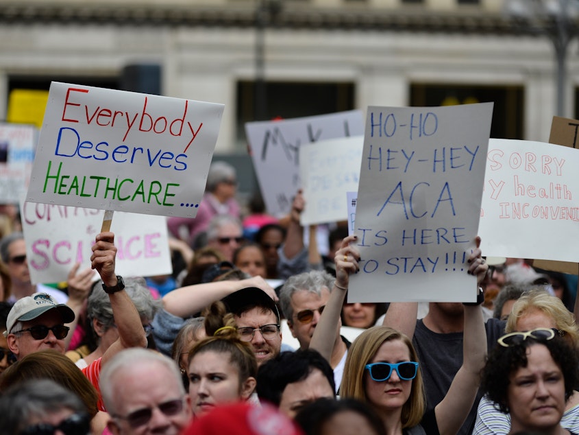 caption: Philadelphia demonstrators protested earlier moves by Republicans to repeal the Affordable Care Act last February. If the ACA is indeed axed as unconstitutional, health policy analysts say, millions of people could lose health coverage, and many aspects of Medicare and Medicaid would change dramatically.