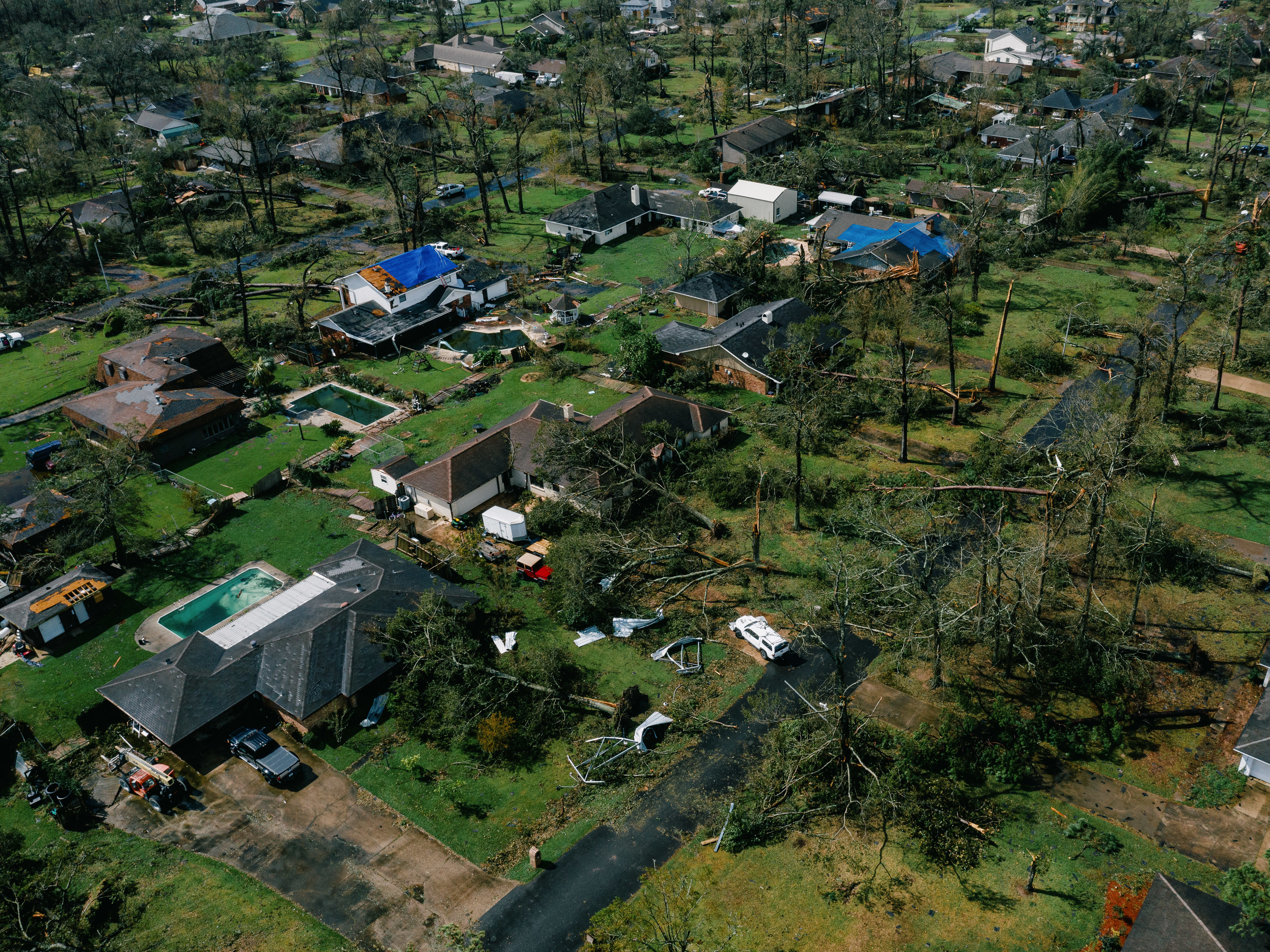 caption: An aerial view of Lake Charles, La., shows damage to houses last week after Hurricane Laura, one of the most powerful storms ever to hit Louisiana, tore through the area.
