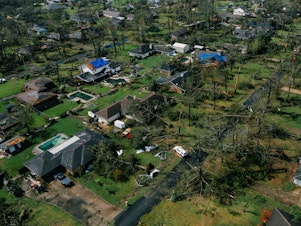 caption: An aerial view of Lake Charles, La., shows damage to houses last week after Hurricane Laura, one of the most powerful storms ever to hit Louisiana, tore through the area.