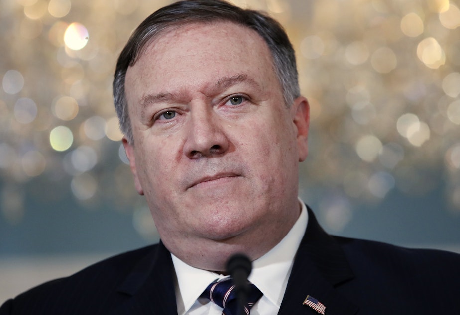 caption: Secretary of State Mike Pompeo speaks about the new limit on refugees to the media Monday at the State Department in Washington.