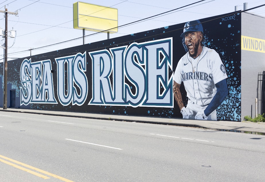 caption: The new SEA US RISE mural on 4th Avenue is walking distance from where the Mariners play.