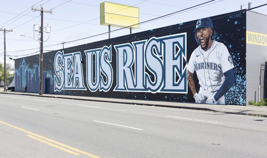caption: The new SEA US RISE mural on 4th Avenue is walking distance from where the Mariners play.