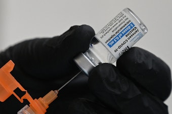 caption: A nurse fills a syringe with Johnson & Johnson's COVID-19 vaccine at a clinic in Pasadena, Calif., on Thursday.